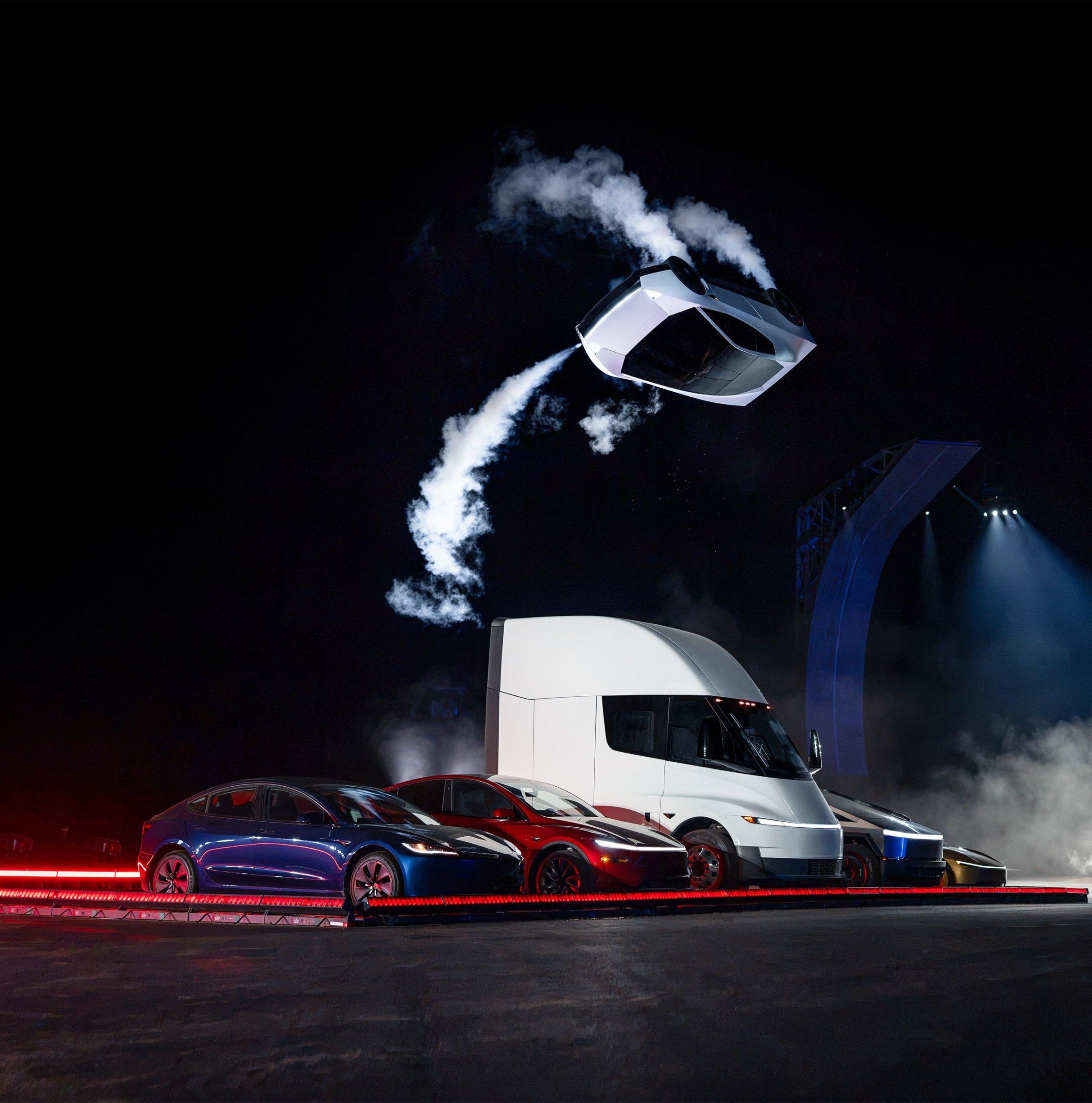 The Tesla Roadster's dramatic reveal included a physical demonstration of its cold-gas thrusters, showcasing its ability to briefly 'fly' off a ramp and perform maneuvers.