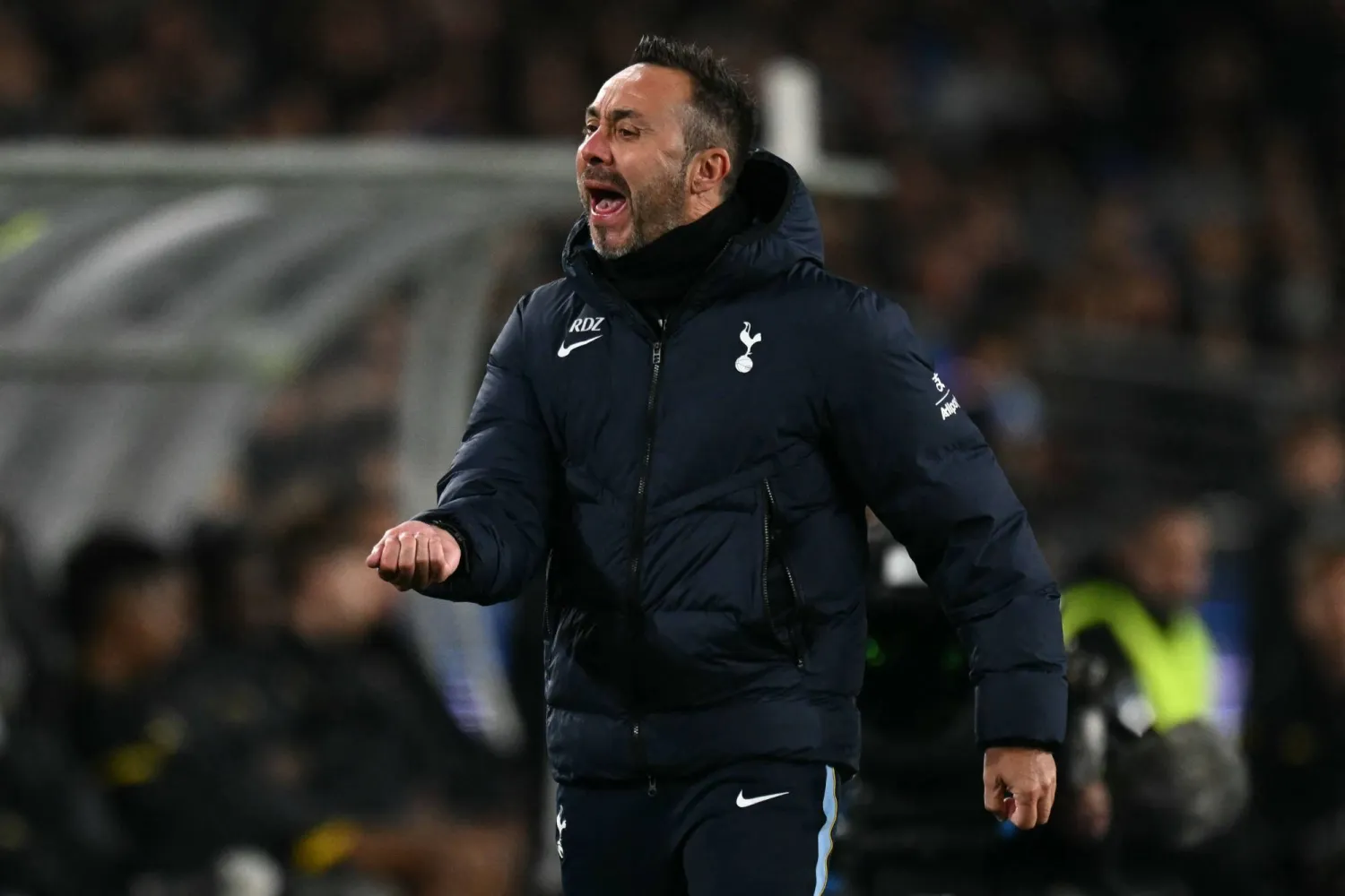 Roberto De Zerbi, Tottenham's new manager, observes play from the sideline, facing the challenge of establishing a clear tactical identity.